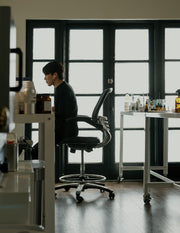 MATTER OF FACT Founder Paul Baek sits at his bench in lab.